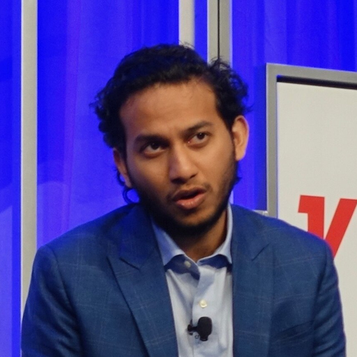 Ritesh Agarwal speaking at a conference